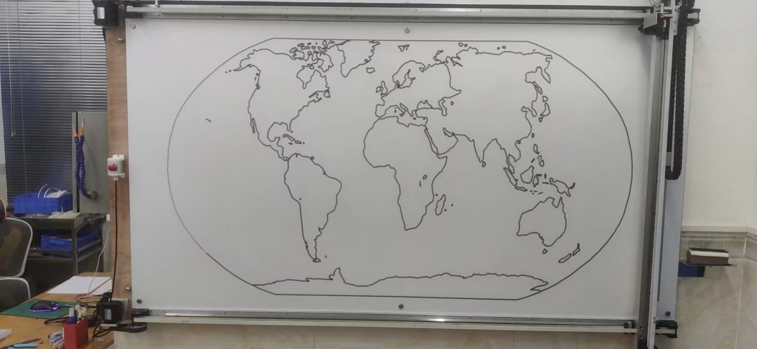 Whiteboard with a plotter and a black outline world map drawn inside an oval.